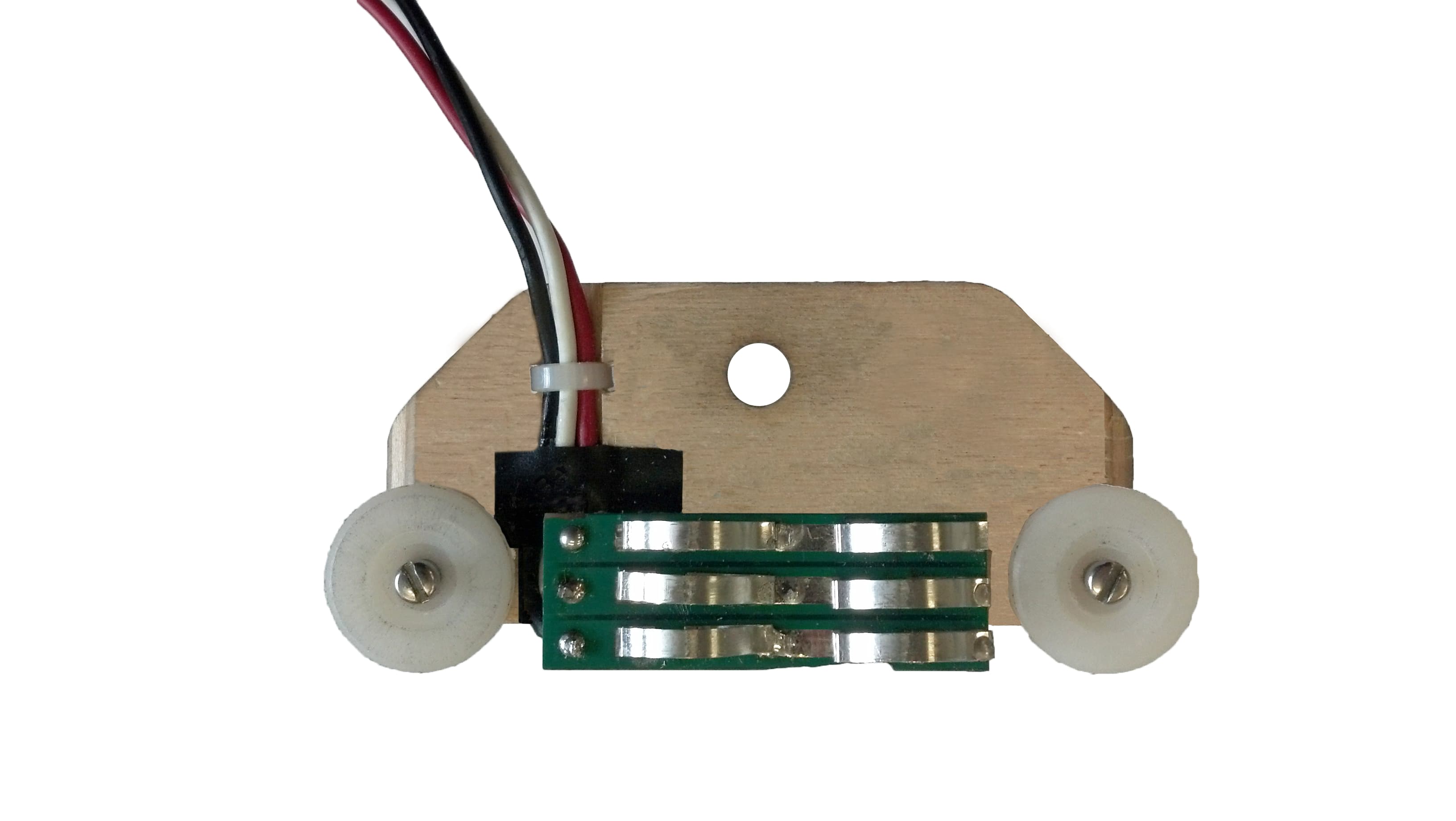 Power trolley prototype: the circuit board between the rollers.