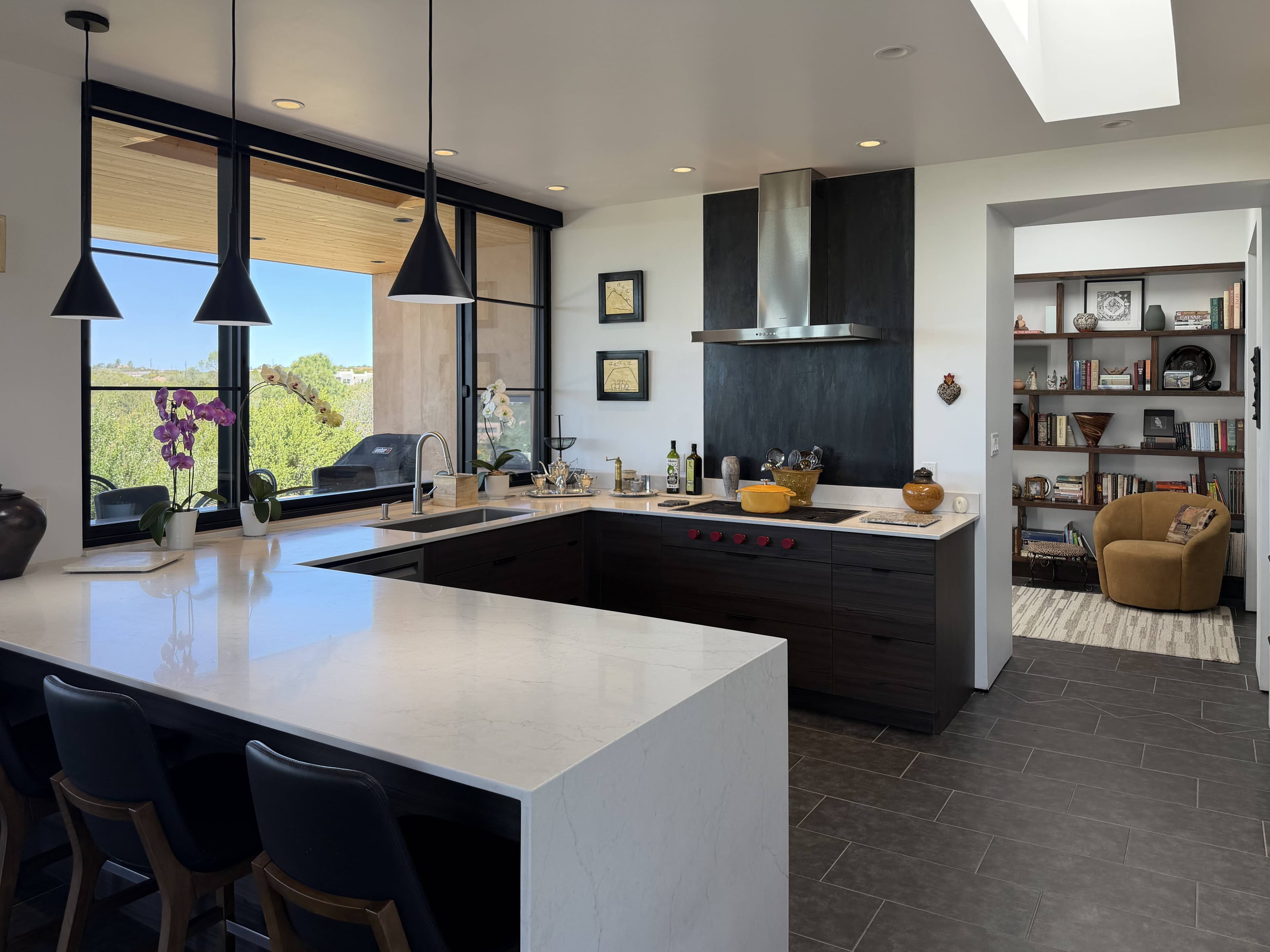 Interior-to-exterior transition at full-height glazing.