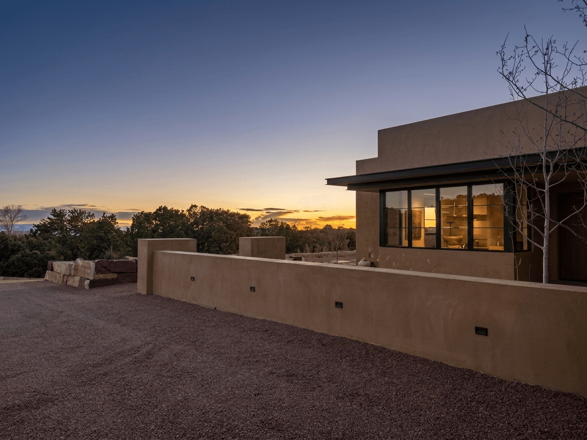 Roofline: steel C-channels sharpen the cantilevered edge.